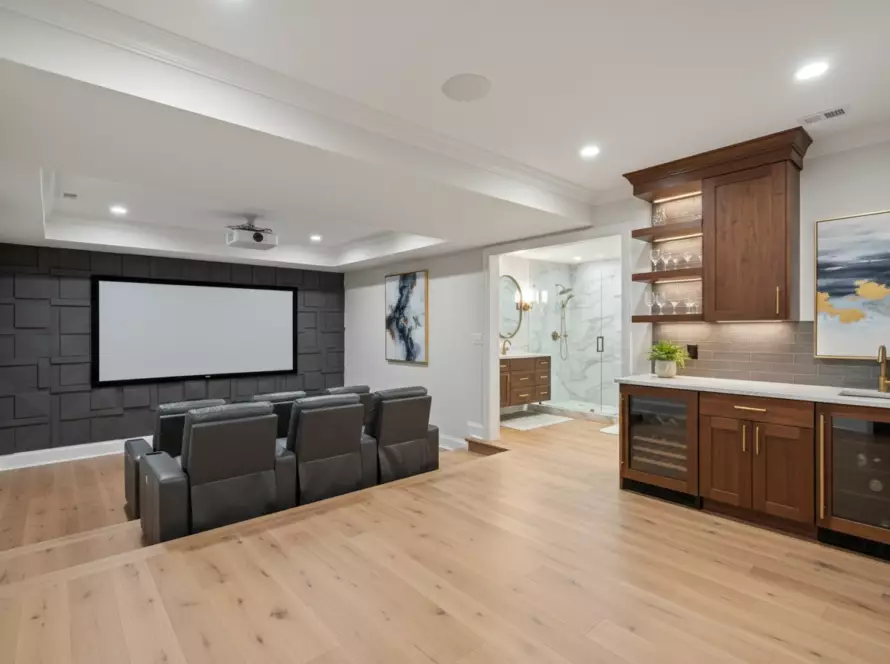 A_brightly_lit__ultra_luxurious_finished_basement_in_a_Johns_Creek__Georgia_home__The_space_features