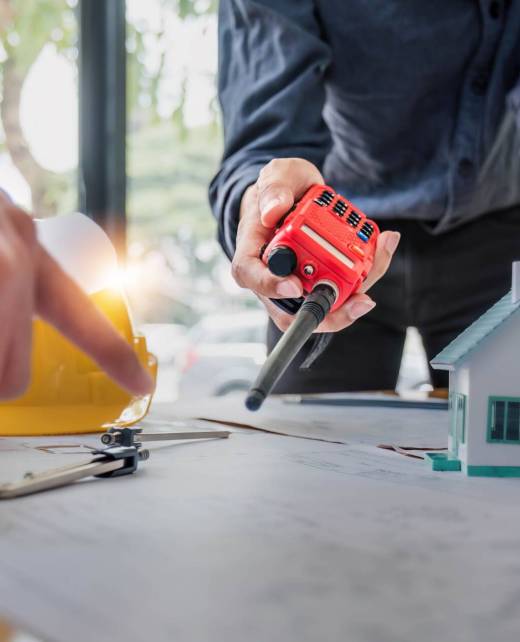 Civil engineer teams meeting working together wear worker helmets hardhat on construction site in modern city. Foreman industry project manager engineer teamwork. Asian industry professional team